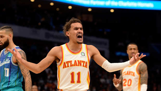 Trae Young yells at a referee.